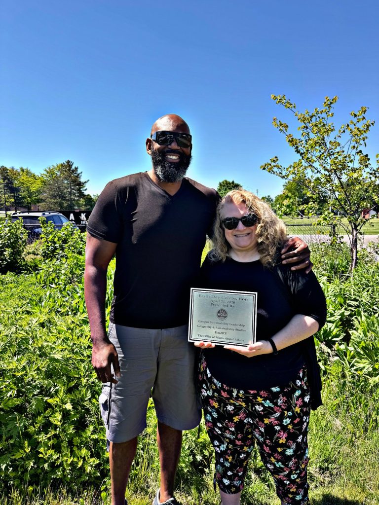 Multicultural Affairs Director Clifton Harcum and WGSU Director Kelli Sperino-Pease with plaque for 2026 Earth Day Celebration