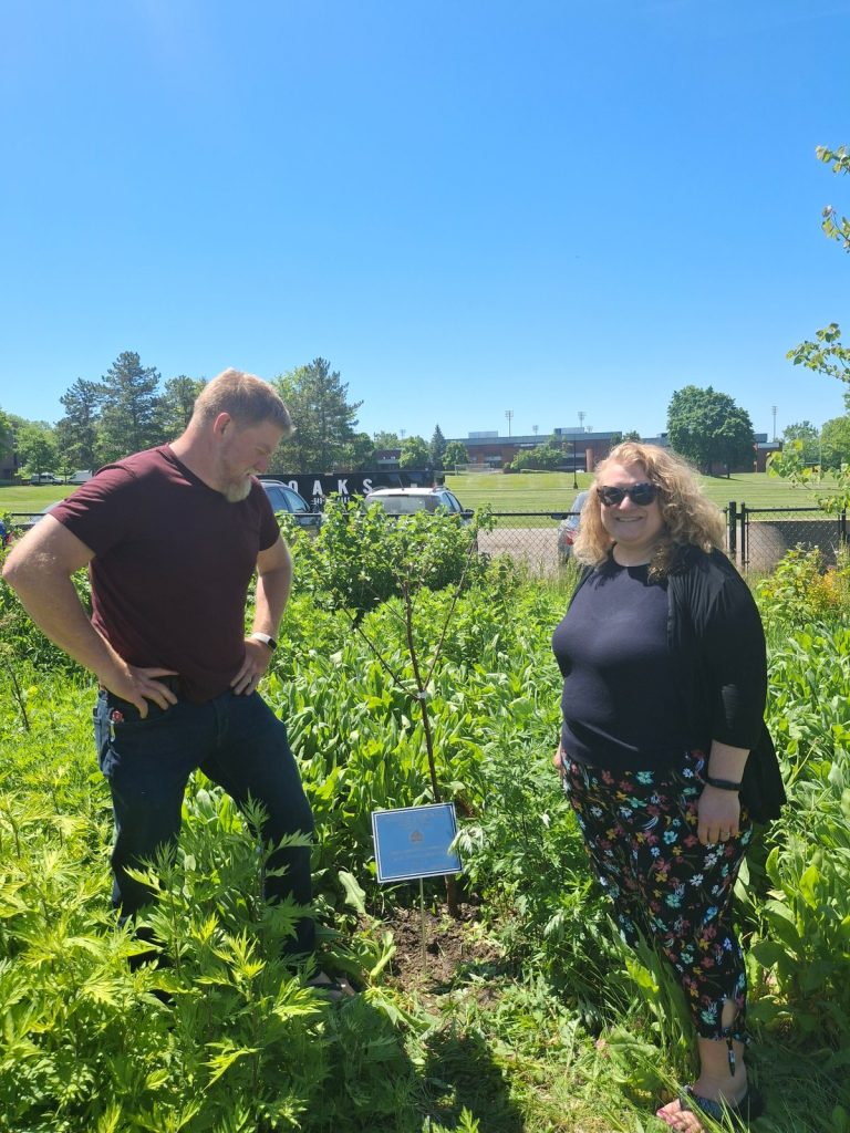 Dan Dezarn from Sustainabilities Studies Program and WGSU Director Kelli Sperino-Pease - cherry tree and plaque - 2026 Earth Day Celebration